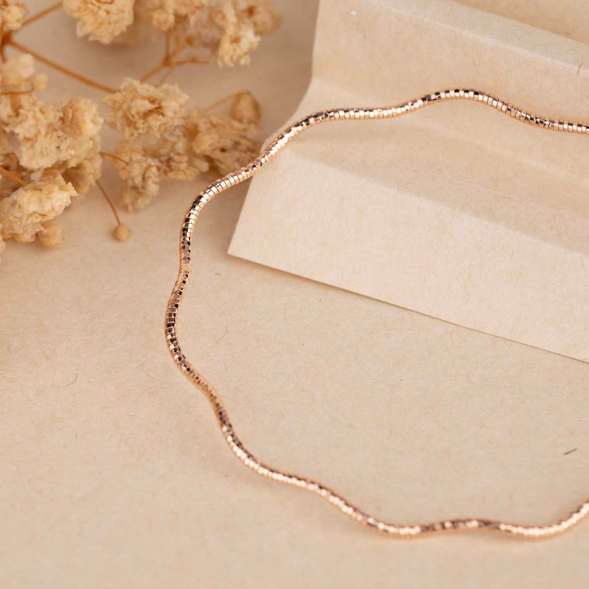 Sleek Wavy Rose Gold Bracelet