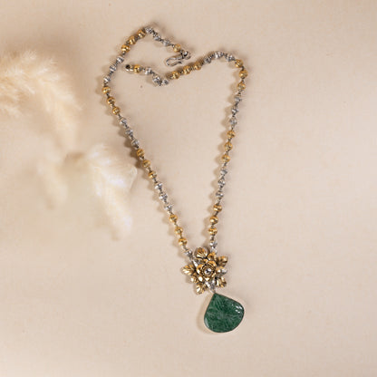 Long sterling silver necklace with a big green colour stone at centre, adding a touch of sophistication to any outfit